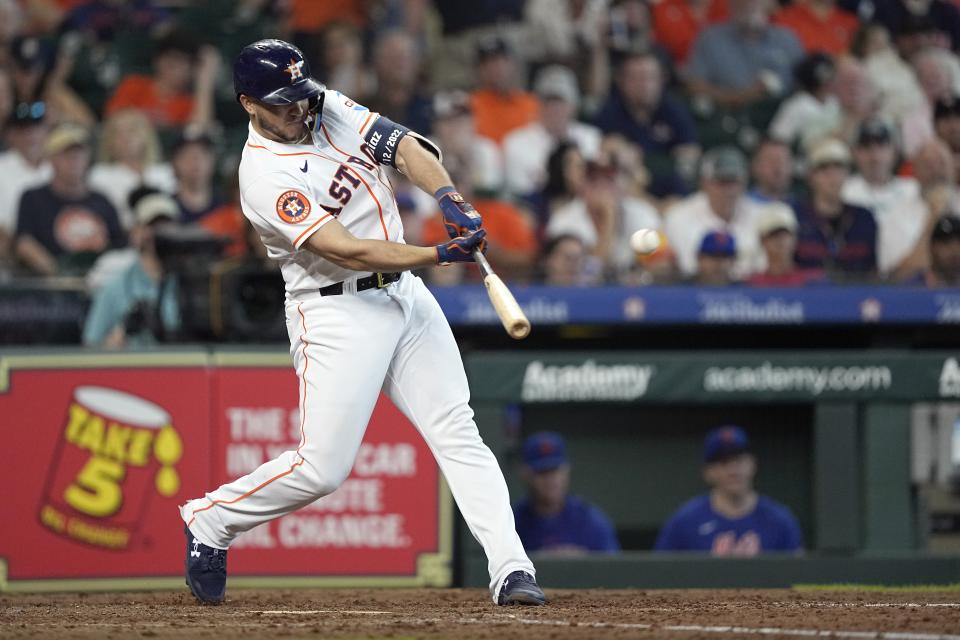 Houston Astros' Yainer Diaz hits a two-run home run against the New York Mets during the fourth inning of a baseball game Wednesday, June 21, 2023, in Houston. (AP Photo/David J. Phillip)