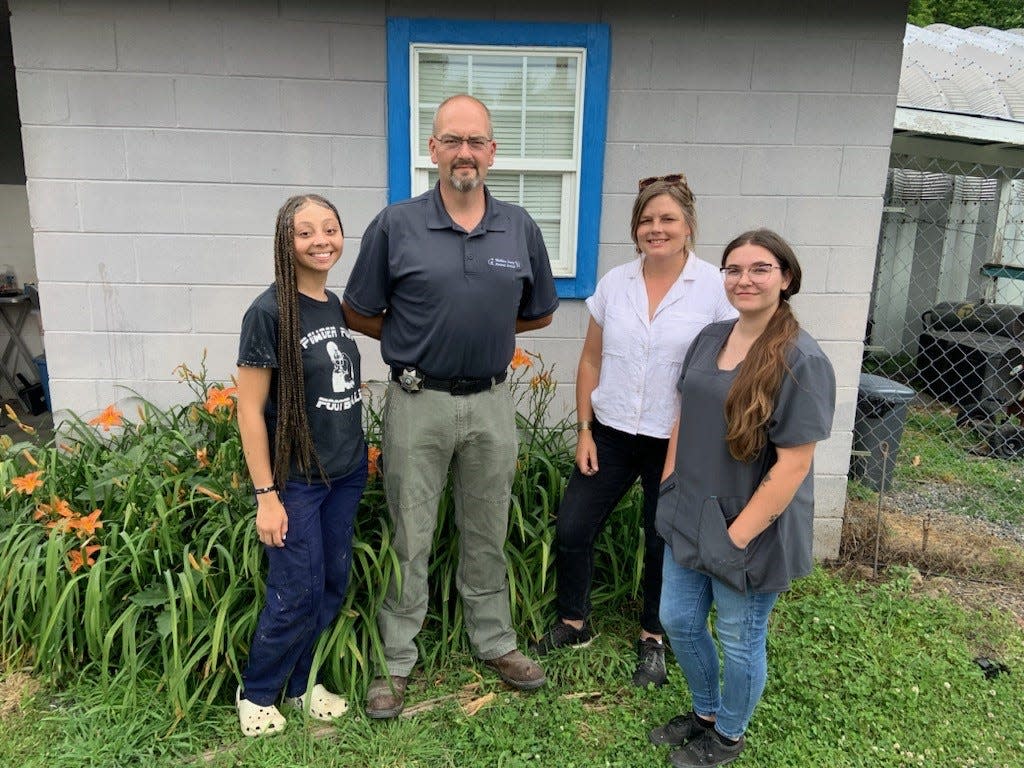 From left are Nevaeh Rice, a Mars Hill University Bonners Scholar who volunteers 20 hours a week at the Animal Services department, Billy Davis, the department's animal control officer, Pia Cash, the department's interim director, and Cedes Oswald, a veterinary assistant.