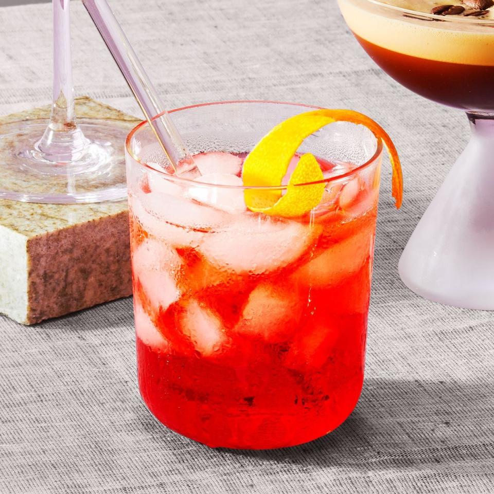 negroni cocktail with a citrus rind on top