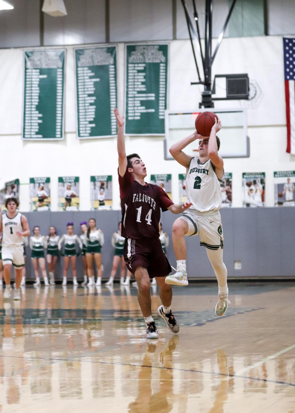 Duxbury's Trevor Jones shoots the ball at the end of a quarter during a game against Falmouth on Friday, Feb. 17, 2023.