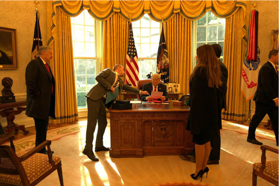 In this image released in the final report by the House select committee investigating the Jan. 6 attack on the U.S. Capitol, on Thursday, Dec. 22, 2022, President Donald Trump reviews his speech with Stephen Miller in the Oval Office of the White House on the morning of Jan. 6, 2021. (House Select Committee via AP)