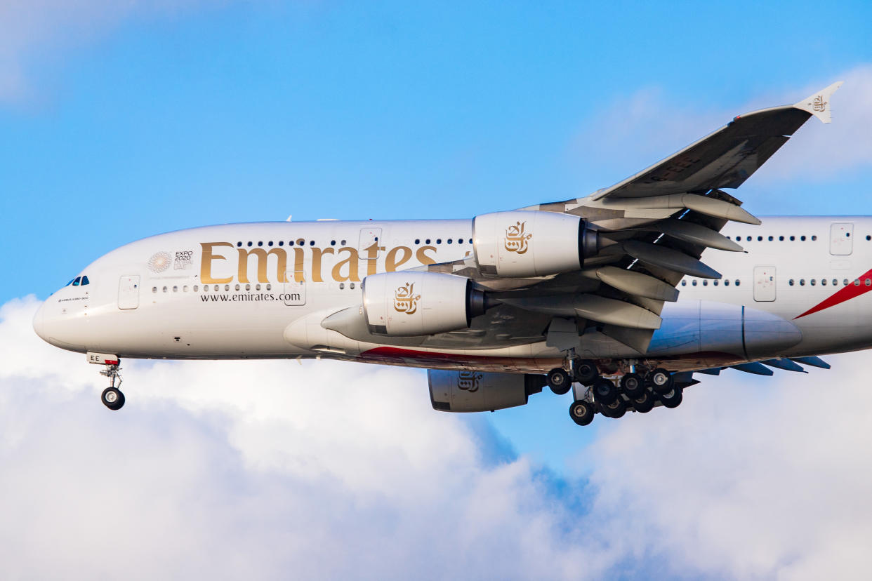 Emirates Airbus A380-800 airplane with registration A6-EEE landing at Amsterdam Schiphol AMS EHAM International Airport in a blue sky with clouds day. Emirates EK or UAE is the large airline in the Middle East and larger Airbus A380 double decker aircraft operator. Emirates connects Amsterdam with DXB OMDB Dubai International Airport daily as it is their hub. The airline is owned by the government of Dubai, United Arab Emirates. (Photo by Nicolas Economou/NurPhoto via Getty Images)