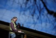 Cynthia Burrell, whose home-based business has been shuttered, at her home in Seattle