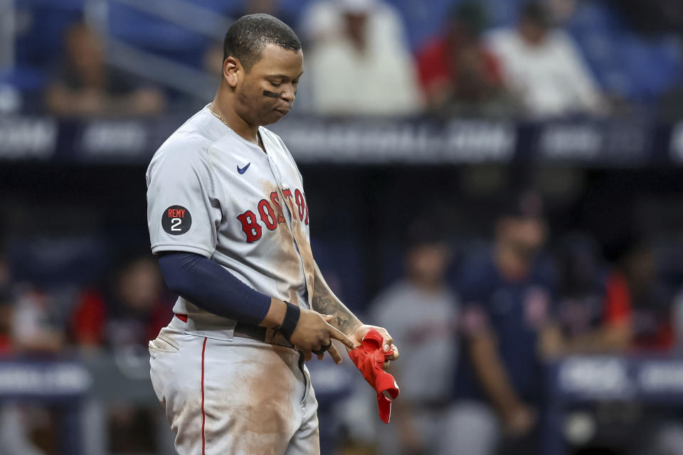 Boston Red Sox's Rafael Devers reacts after striking out against the Tampa Bay Rays during the eighth inning of a baseball game Tuesday, Sept. 6, 2022, in St. Petersburg, Fla. The Rays won 8-4. (AP Photo/Mike Carlson)