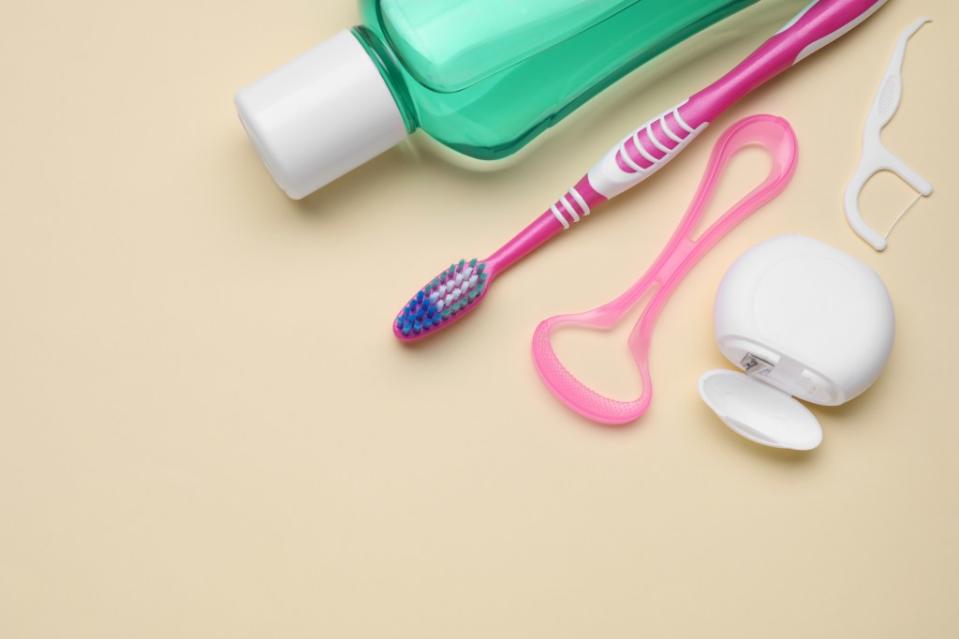 Buying floss and tongue scrapers is an investment in your health. New Africa – stock.adobe.com