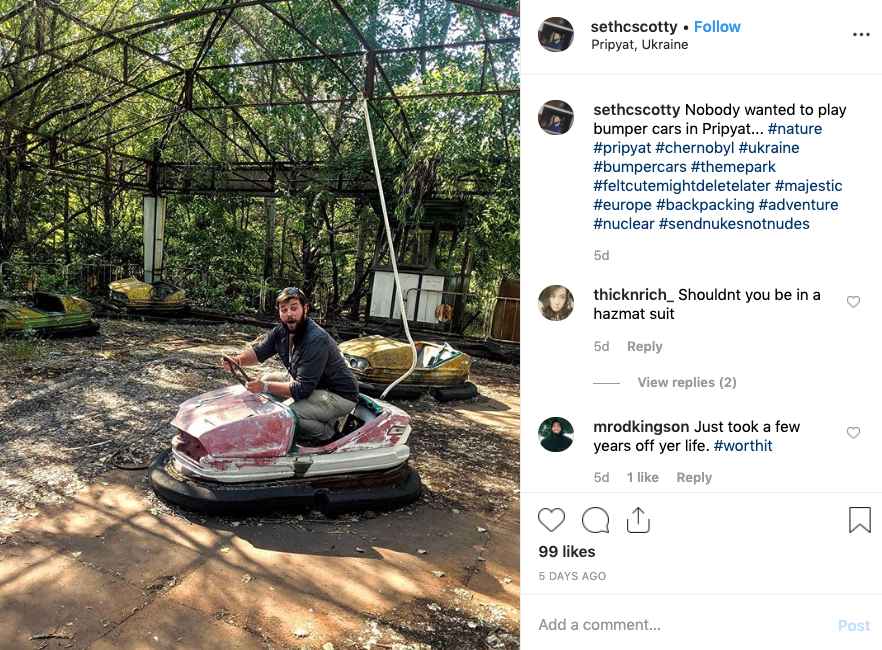 A man sits in a broken dodgem car in Chernobyl.