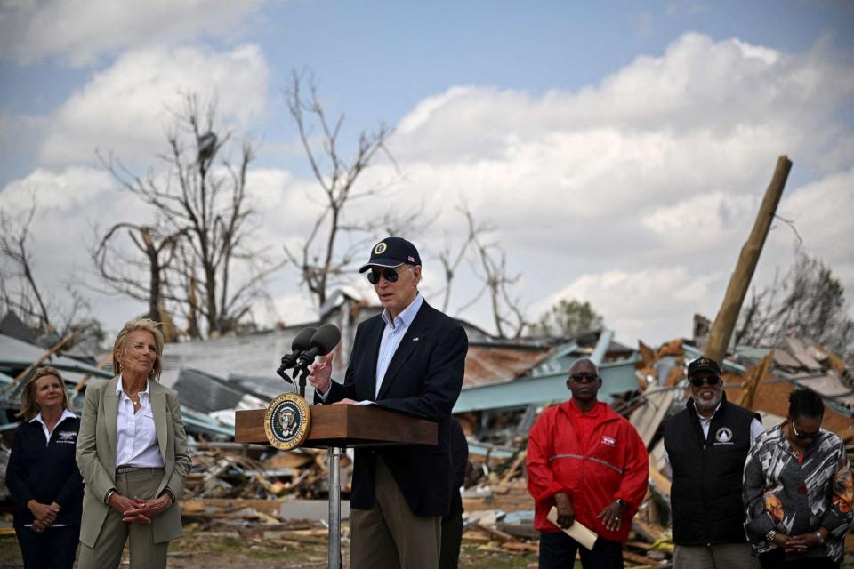 PHOTO: In this March 31, 2023, file photo, President Joe Biden speaks in Rolling Fork, Mississippi, as First Lady Jill Biden (2nd L) and Federal Emergency Management Agency (FEMA) Deanne Criswell (L) look on. (Mandel Ngan/AFP via Getty Images, FILE)