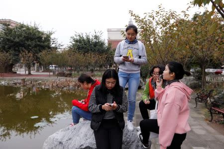 Students majoring in esports and management play games on their phones at the campus of the Sichuan Film and Television University in Chengdu, Sichuan province, China, November 19, 2017. REUTERS/Tyrone Siu