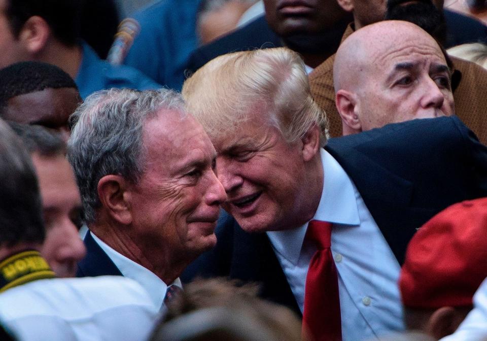 President Donald Trump speaks to former New York City Mayor Michael Bloomberg during a memorial service at the National 9/11 Memorial September 11, 2016 in New York.