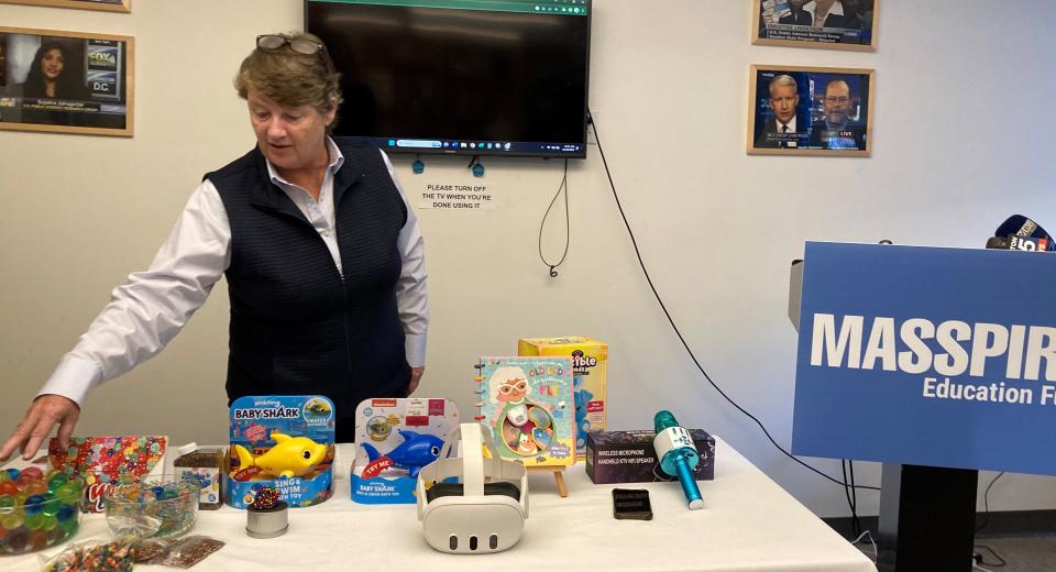 Deirdre Cummings, MassPIRG consumer program director, points out the hazards of some of the troublesome toys on the list released by the organization.