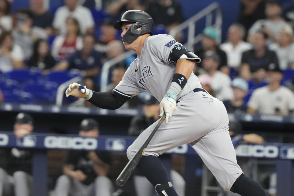 New York Yankees' Aaron Judge hits a single during the first inning of baseball game against the Miami Marlins, Saturday, Aug. 12, 2023, in Miami. (AP Photo/Marta Lavandier)