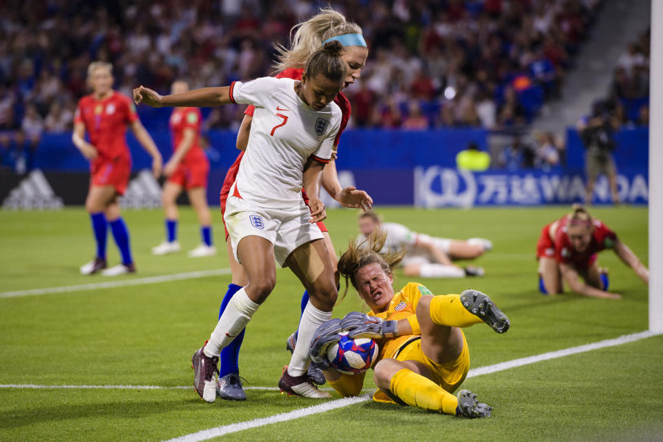 LYON, FRANCE - JULY 02: Goalkeeper Alyssa Naeher of United States (R) defends the ball during the 2019 FIFA Women's World Cup France Semi Final match between England and USA at Stade de Lyon on July 2, 2019 in Lyon, France. (Photo by Marcio Machado/Getty Images)
