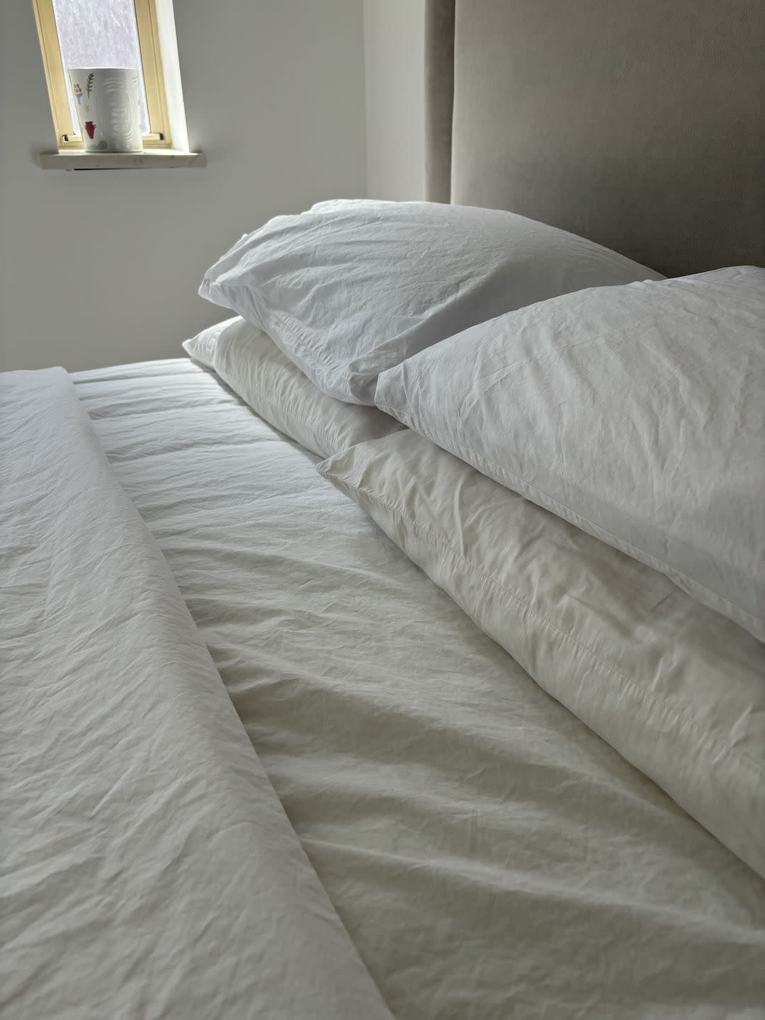 a bed with a white sheet