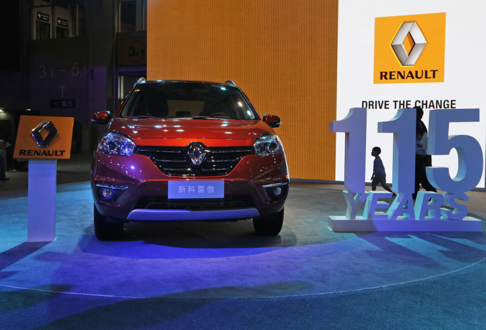 In this Nov. 21, 2013 photo, a Renault Koleos is displayed at the company's booth during the Guangzhou 2013 Auto Show in China's southern city of Guangzhou. French automakers Renault and Peugeot are looking belatedly to China to revive their flagging fortunes but picked a tough time to try to expand. Europe’s auto sales slumped in 2013 to their lowest level since 1995, forcing French brands to join U.S. and European rivals in looking to China to drive revenues. (AP Photo/Kin Cheung)