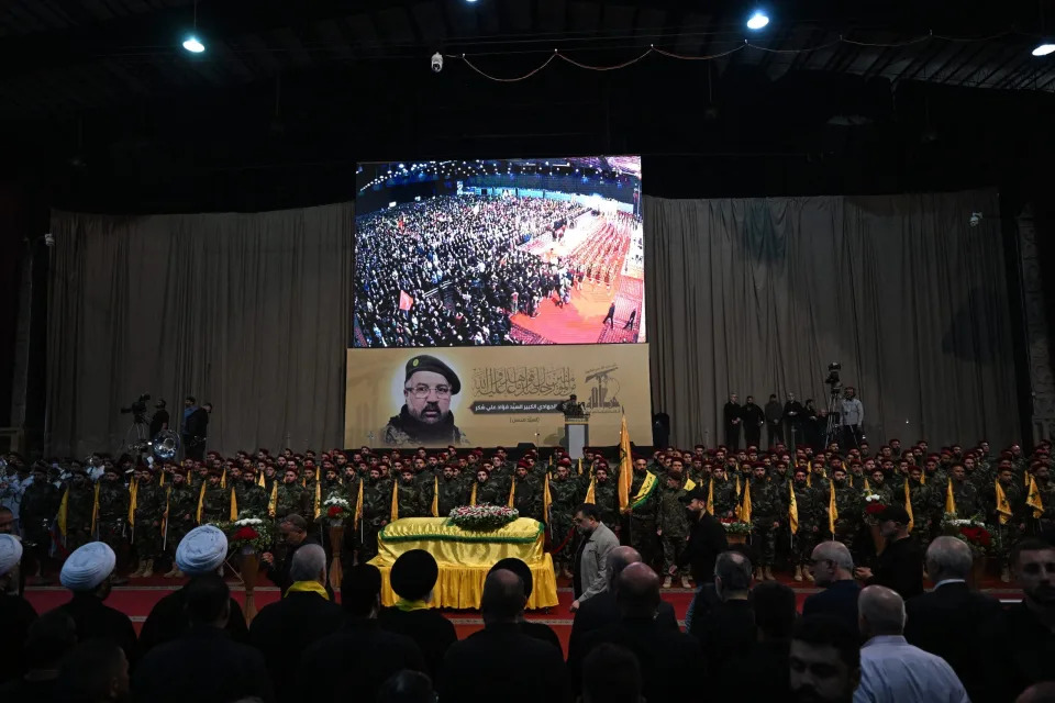 Hezbollah fighters and mourners attend the funeral of slain top commander Fuad Shukr in Beirut's southern suburbs on August 1, 2024. Hezbollah on August 1 mourned Shukr, whose body was recovered from the rubble of a July 30 Israeli strike in south Beirut that also killed five civilians, three women and two children, and injured dozens, according to Lebanon's health ministry, as fears mounted of a wider conflict in the region.