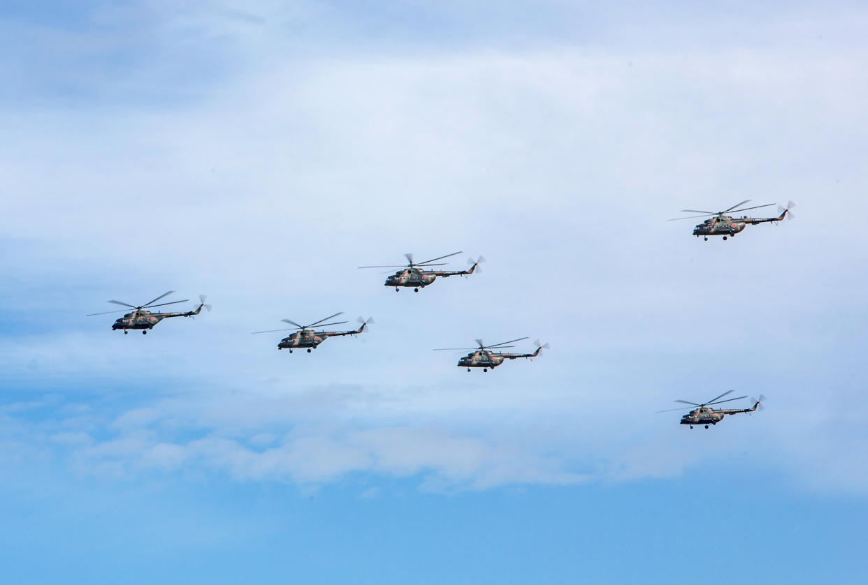 <em>Russian military helicopters fly during the V<span class="s1">ostok (East) 2018 manoeuvres (</span>AP)</em>