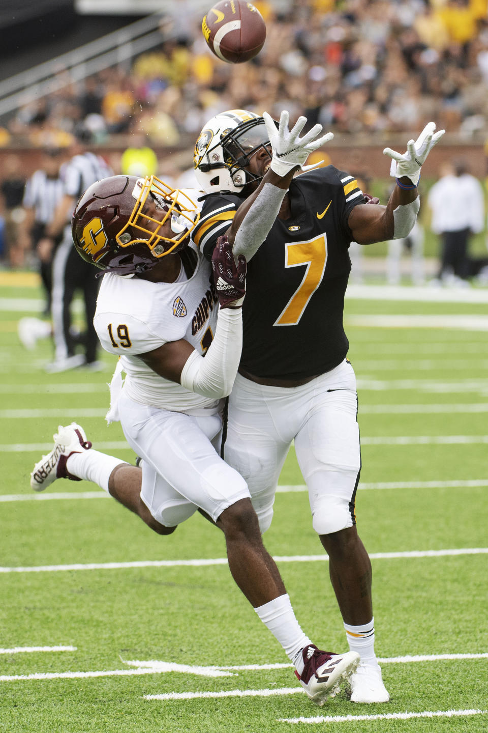 Central Michigan's Donte Kent, left, breaks up a pass intended for Missouri's Dominic Lovett, right, during the first half of an NCAA college football game Saturday, Sept. 4, 2021, in Columbia, Mo. (AP Photo/L.G. Patterson)