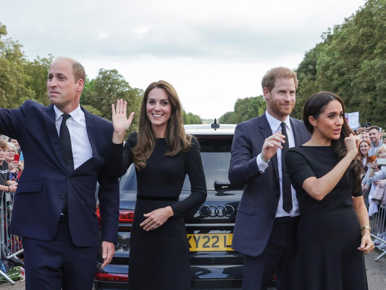 Prince William, Princess Kate, Prince Harry, and Meghan Markle wave as they walk around Windsor Castle