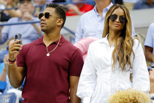 Russell Wilson and Ciara during a women's singles match at the