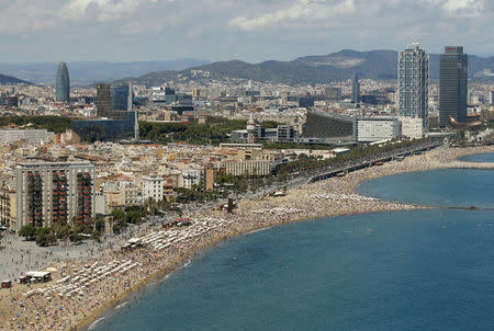 A view of Sant Sebastia and Sant Miquel, Barceloneta and Somorrostro beaches in Barceloneta neighborhood in Barcelona, Spain, August 16, 2015. REUTERS/Albert Gea/File Photo