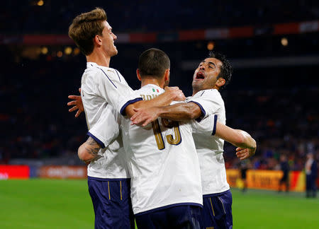 Football Soccer - Netherlands v Italy - International Friendly - Arena Stadium, Amsterdam, Netherlands - 28/3/17 - Italy’s Leonardo Bonucci celebrates with teammates after scoring a goal against the Netherlands. Reuters/Michael Kooren