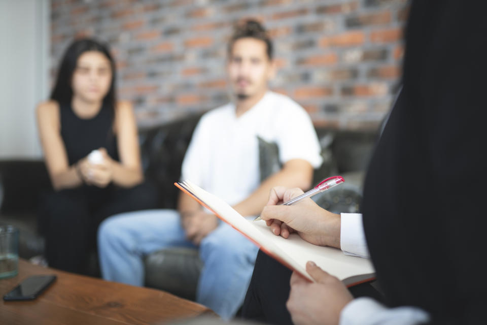 couples therapists taking notes