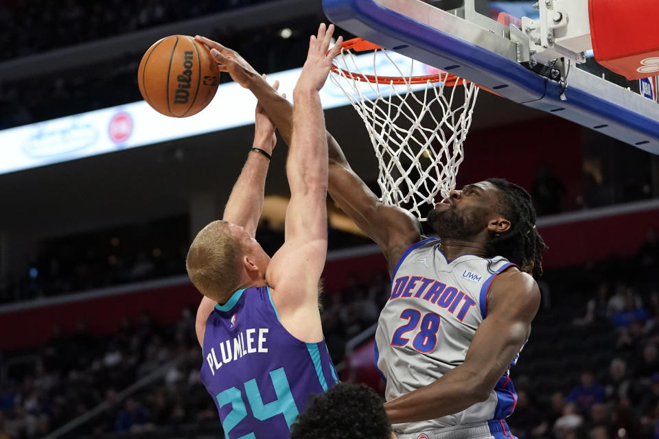 Detroit Pistons center Isaiah Stewart (28) blocks a Charlotte Hornets center Mason Plumlee (24) shot in the first half of an NBA basketball game in Detroit, Friday, Feb. 11, 2022. (AP Photo/Paul Sancya)