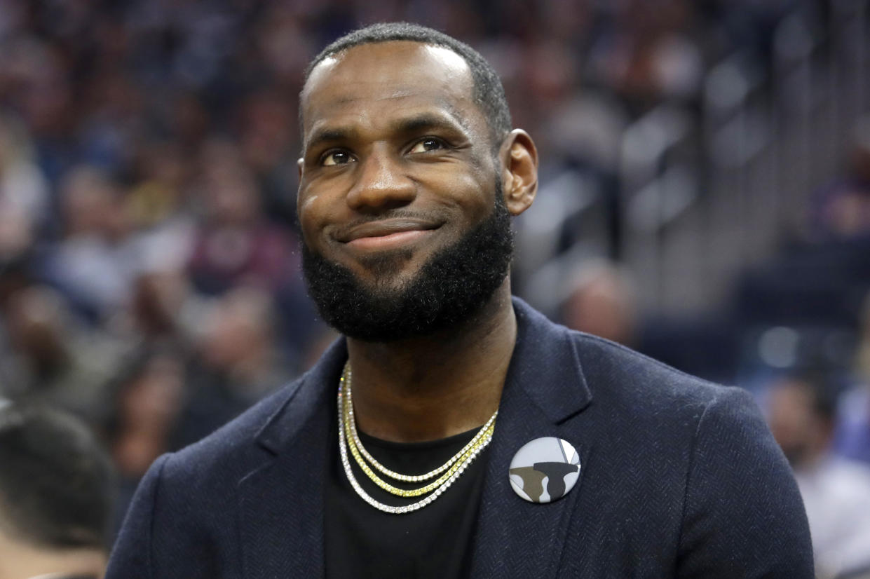 FILE - In this Feb. 27, 2020 file photo, Los Angeles Lakers forward LeBron James appears during an NBA basketball game against the Golden State Warriors in San Francisco. Though the coronavirus pandemic has upended graduation season, James is putting together an all-star event to honor and celebrate the Class of 2020. The one-hour special, "Graduate Together: America Honors the High School Class of 2020," will air simultaneously on NBC, ABC, CBS and Fox on May 16 at 8 p.m. EDT. (AP Photo/Jeff Chiu, File)