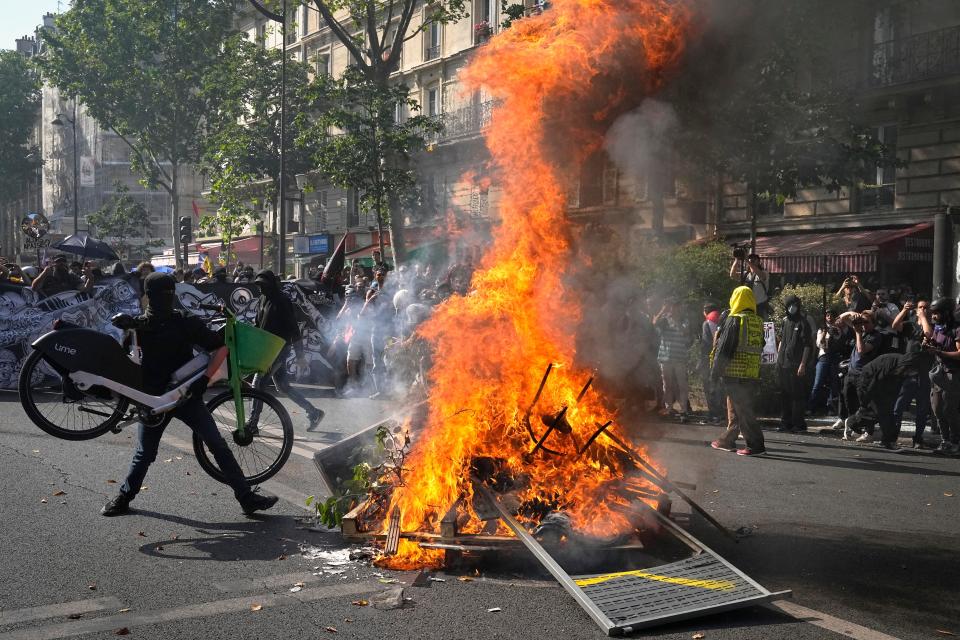 Protesters in Paris rally as French unions try to reignite resistance to President Emmanuel Macron's higher retirement age with a surge of nationwide protests and scattered strikes on Tuesday.