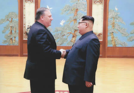 A U.S. government handout photo released by White House Press Secretary Sarah Huckabee Sanders shows U.S. Central Intelligence (CIA) Director Mike Pompeo meeting with North Korean leader Kim Jong Un in Pyongyang, North Korea in a photo that Sanders said was taken over Easter weekend 2018. U.S. Government via REUTERS