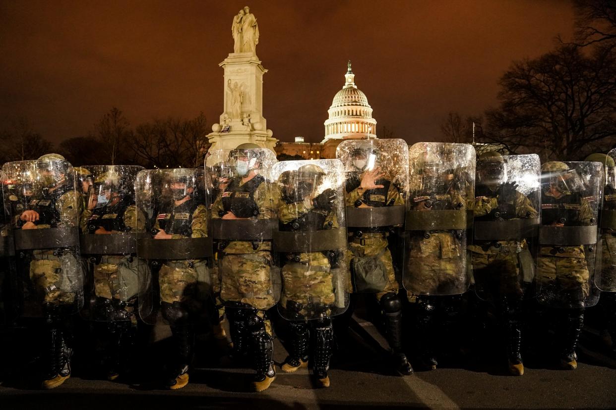 District of Columbia National Guardsmen stand outside the Capitol on Jan. 6, 2021, after a day of rioting protesters.