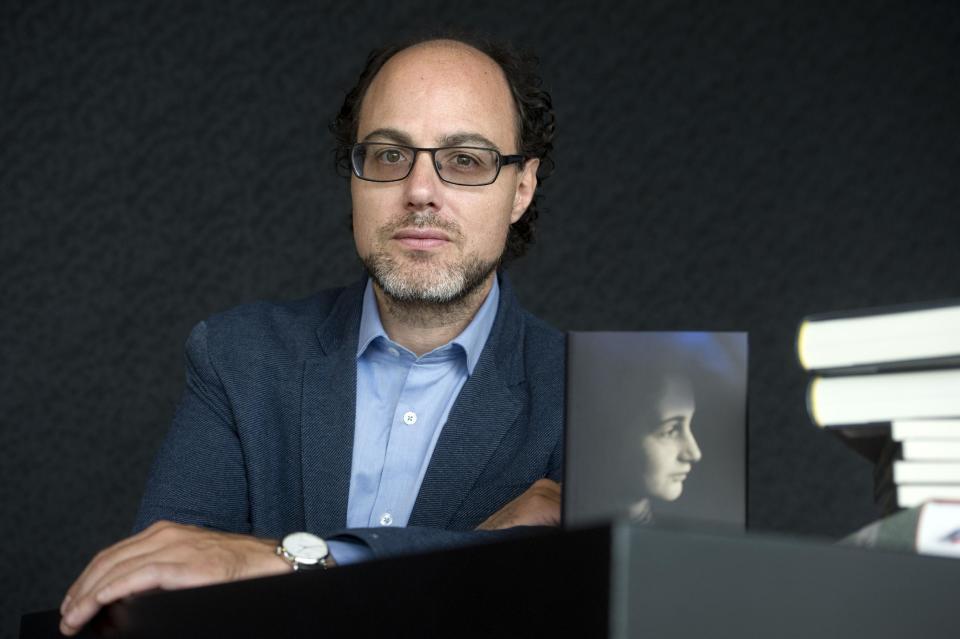 In this photo taken Friday, May 2, 2014 Yves Kugelmann, spokesman of the Anne Frank Fonds in Basel, Switzerland, poses during an interview with the Associated Press at Theater Amsterdam. Seeking to engage a new generation with the tragic story of Anne Frank, a major new play based on the Jewish teenager's diary opens Thursday, May 8, 2014 in Amsterdam. It's the first time a theatrical production has been forged directly from Frank's actual writings since the award-winning 1950s play that escalated her story, then little-known, to the world's attention. It's being staged in a purpose-built 1,100 seat theater that includes a replica of the secret apartment where Frank and her family hid from the Nazis in World War II. (AP Photo/Evert Elzinga)