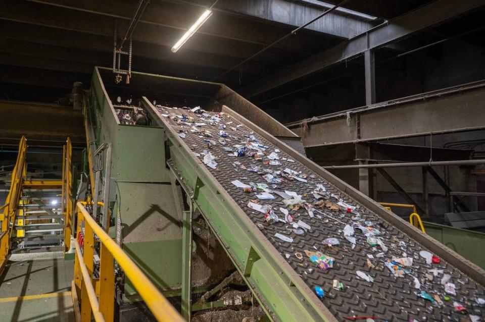 A variety of recycling materials are seen being separated by a machine at the Waste Management recycling facility on Thursday, March 16, 2023, in Kansas City, Kan.