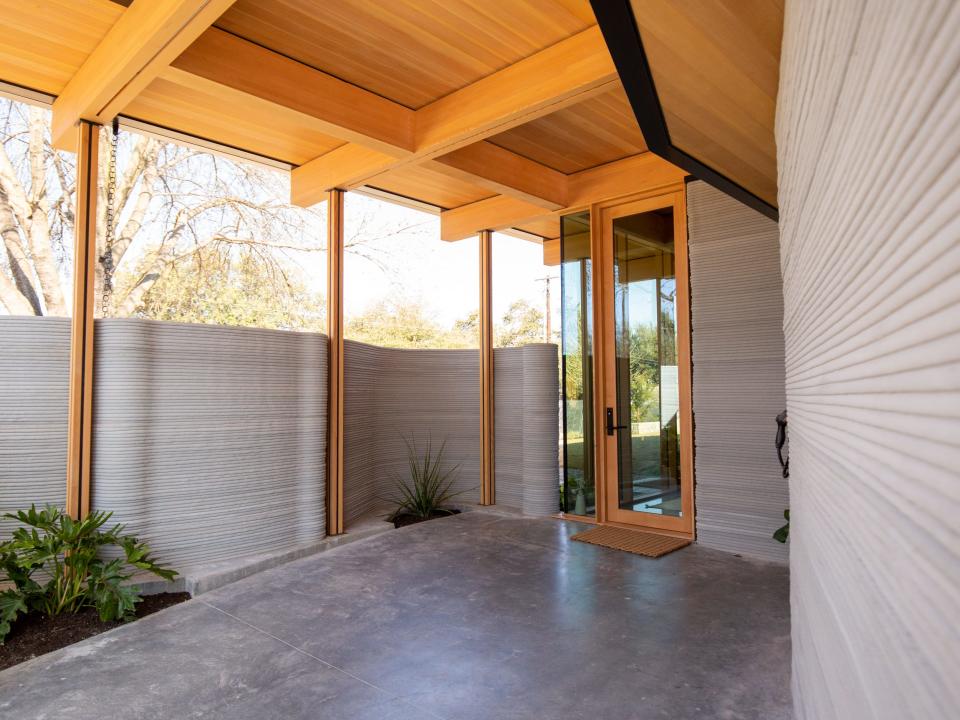 Icon's over 2,000-square-foot House Zero in Austin. There's a printed exterior wall that makes up the outdoor garage.