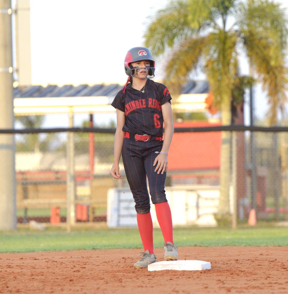 Seminole Ridge's Hailey Goode stands atop second base after advancing on a single by her teammate during a regional quarterfinal against Viera on May 9, 2024.