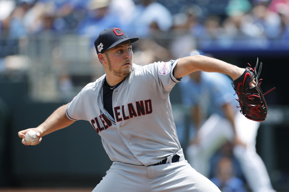 Cleveland Indians pitcher Trevor Bauer throws against the Kansas City Royals in the first inning of a baseball game at Kauffman Stadium in Kansas City, Mo., Sunday, July 28, 2019. (AP Photo/Colin E. Braley)