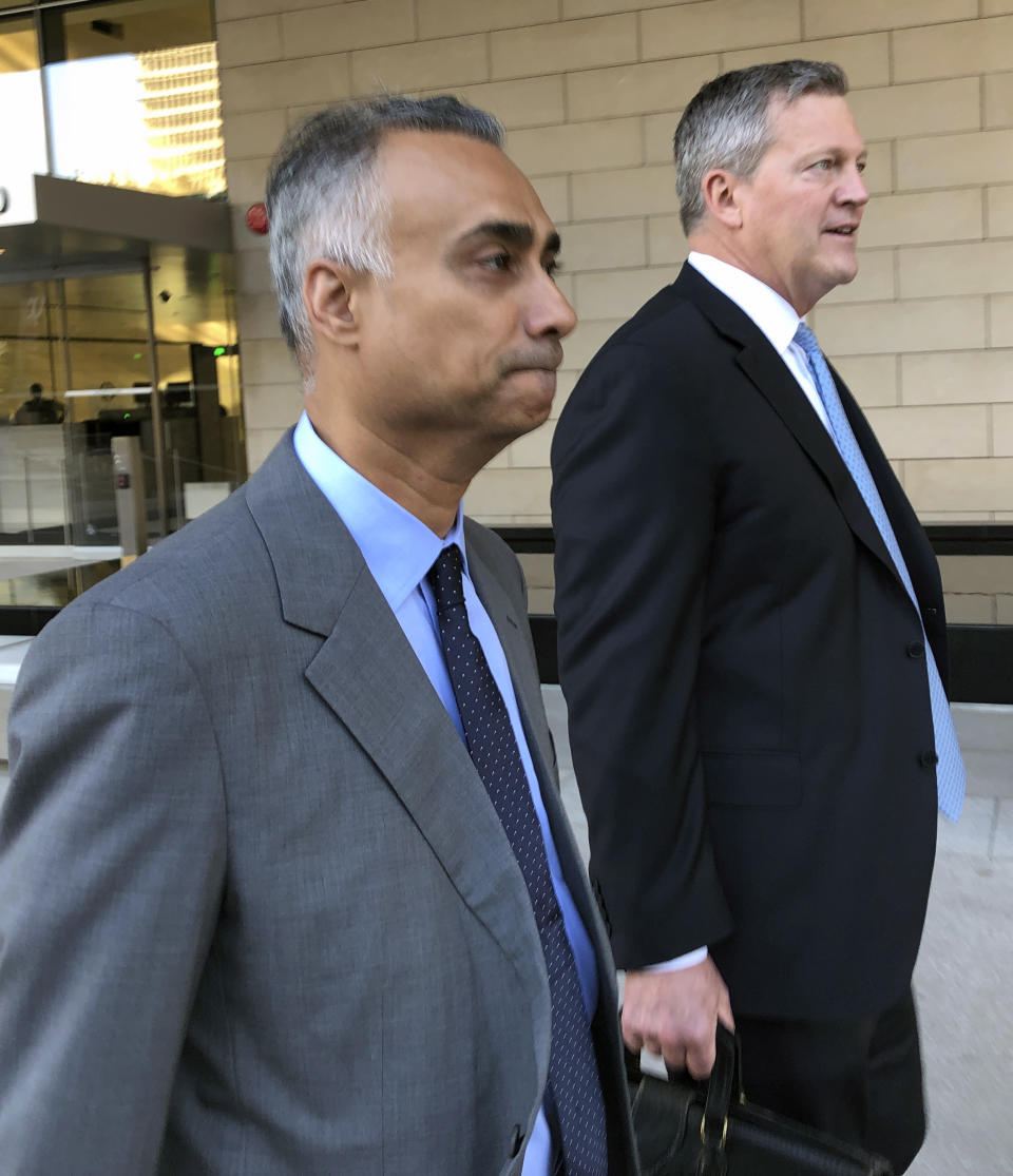 Imaad Zuberi, left, leaves the federal courthouse with his attorney Thomas O'Brien, right, in Los Angeles on Friday, Nov. 22, 2019. Zuberi pleaded guilty to funneling donations from foreigners to U.S. political campaigns. (AP Photo/Brian Melley)