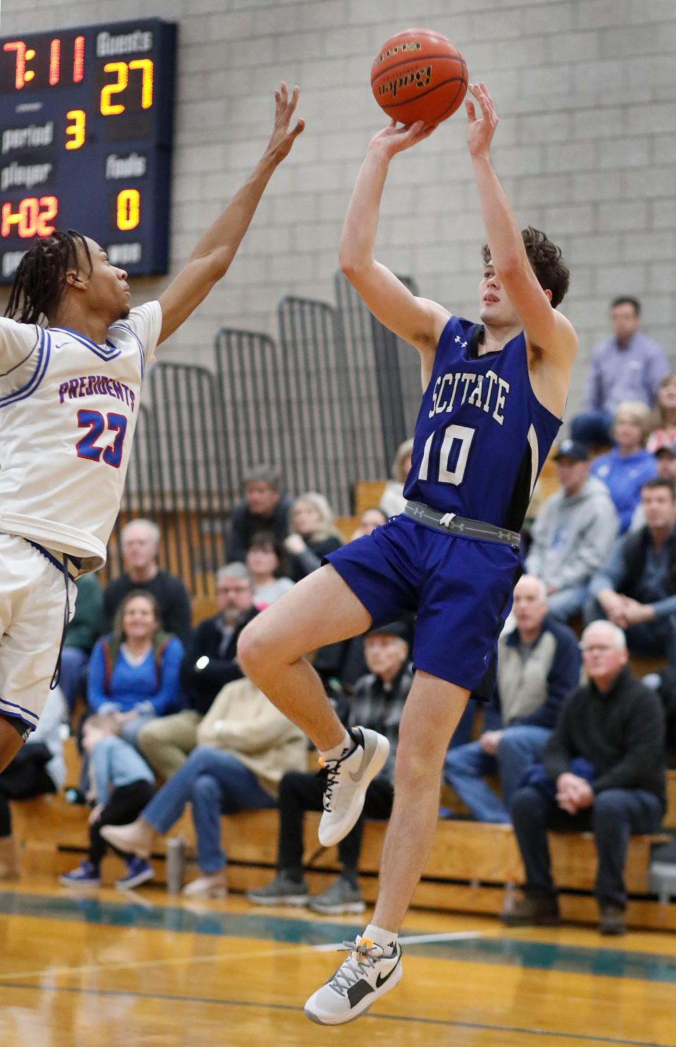 Sailor Michael Porter takes a fall away jumper.
Quincy hosts Scituate in boys basketball on Friday Feb. 2, 2024