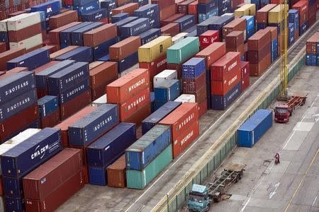 Containers are seen at a port of Shanghai Free Trade Zone, February 11, 2014. REUTERS/Aly Song