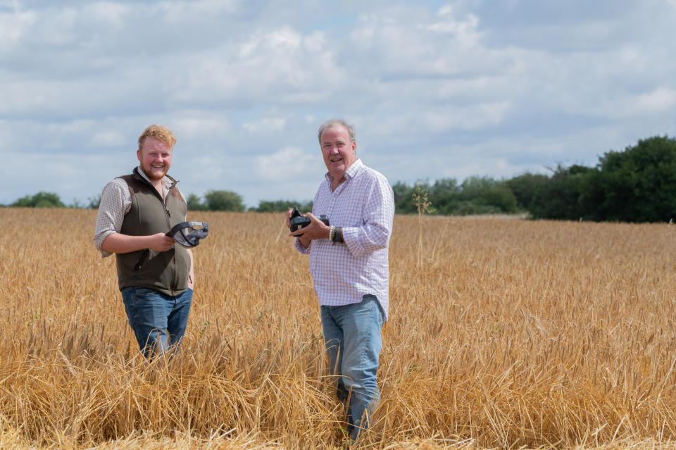 Jeremy Clarkson and Caleb Cooper standing in a field