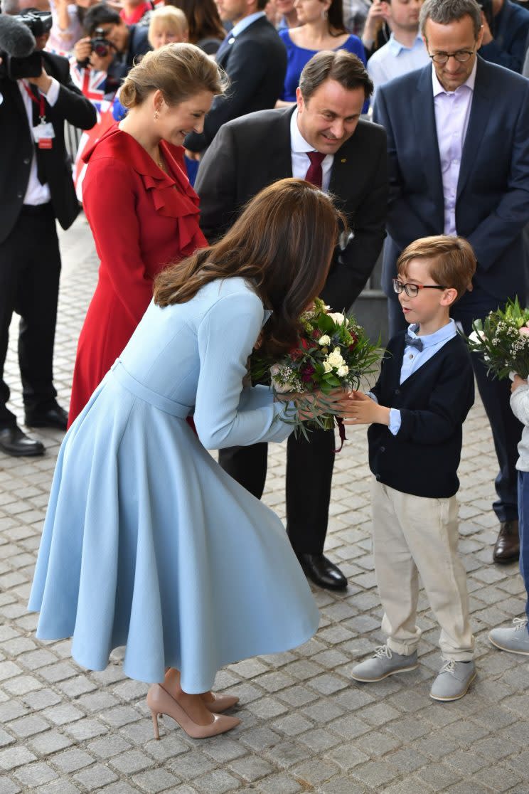 <i>Kate was given flowers by local children [Photo: PA]</i>