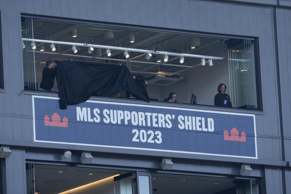 FC Cincinnati unveils a placard commemorating the 2023 MLS Supporters' Shield season prior to the first half of a MLS soccer match against Toronto FC, Sunday, Feb. 25, 2024, in Cincinnati. (AP Photo/Jeff Dean)