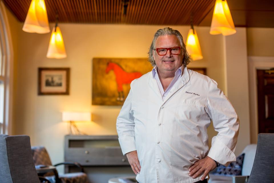 Chef David Burke in front of the Red Horse painting inside the new Red Horse restaurant in Bernardsville.