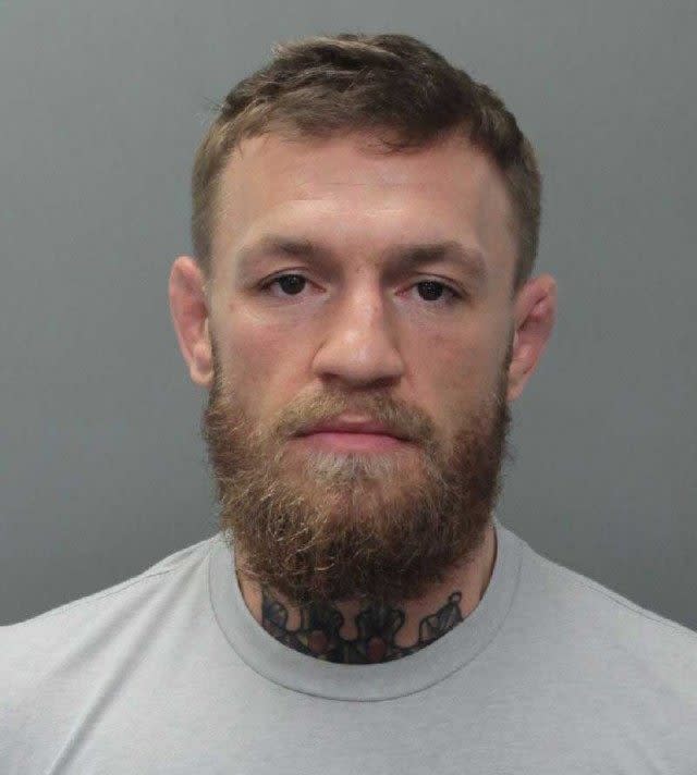 The UFC star is being held on $12,500 bail after allegedly destroying a fan's phone.