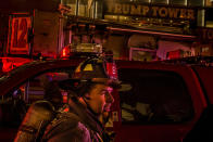 <p>A firefighter works in front of Trump Tower after a fire in New York, Saturday, April 7, 2018. (Photo: Andres Kudacki/AP) </p>