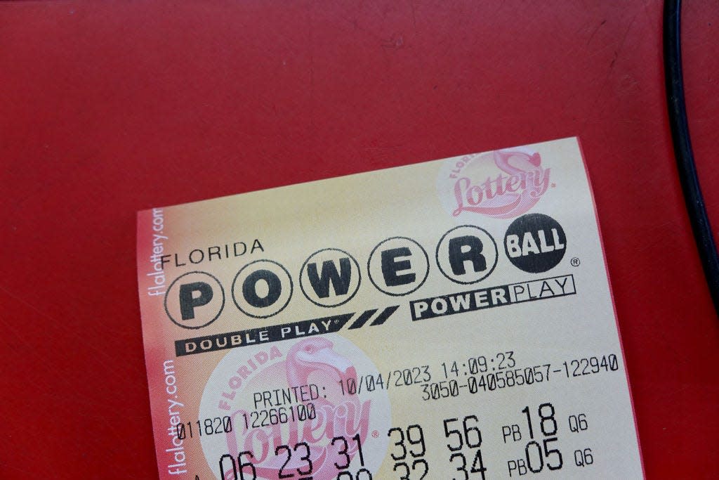 A Florida Powerball ticket is seen on a counter.