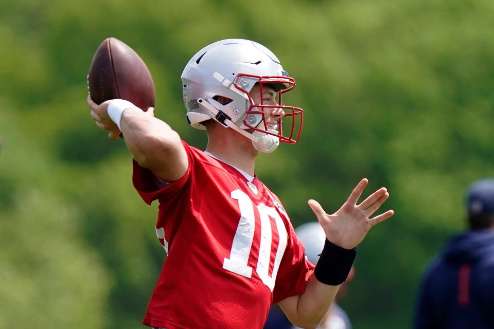 New England Patriots quarterback Mac Jones takes part in drills at the NFL football team's practice facility in Foxborough, Mass., Monday, May 23, 2022. (AP Photo/Steven Senne)