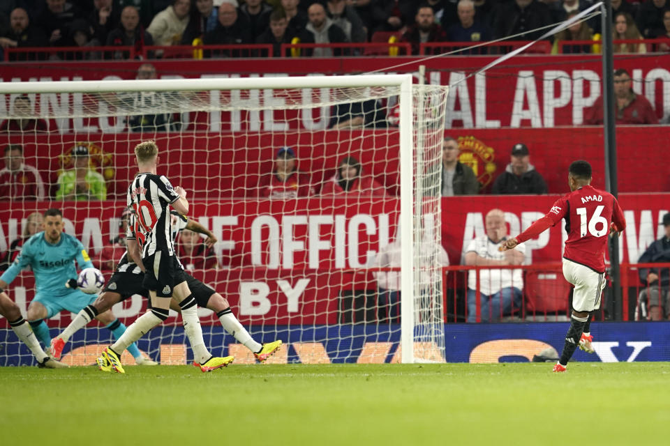 Manchester United's Amad Diallo, right, scores his side's second goal during the English Premier League soccer match between Manchester United and Newcastle United, in Manchester, England, Wednesday, May 15, 2024. (AP Photo/Dave Thompson)