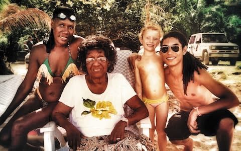  Jones, far left, in Goldeneye, Jamaica, Christmas 2014, with her mother Marjorie, son Paulo and his daughter Athena - Credit: GRACE JONES PRIVATE LIFE COLLECTION. I’LL NEVER WRITE MY MEMOIRS BY Grace Jones (simon & schuster, £8.99)