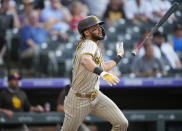San Diego Padres' Fernando Tatis Jr. tosses his bat after hitting a two-run home run off Colorado Rockies starting pitcher Chi Chi Gonzalez during the first inning of a baseball game Tuesday, June 15, 2021, in Denver. (AP Photo/David Zalubowski)